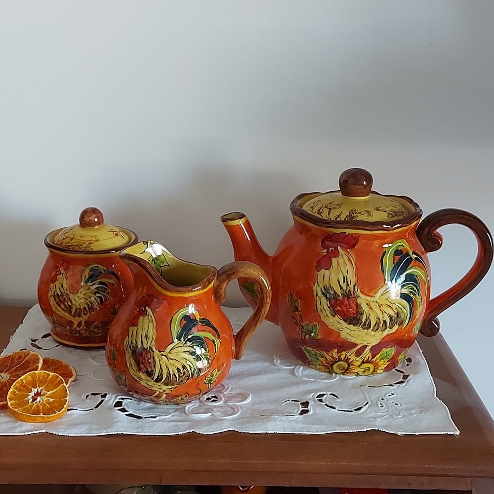 Maxcera Corp. 'Orange Rooster' ceramic tea set with teapot, creamer, sugar bowl